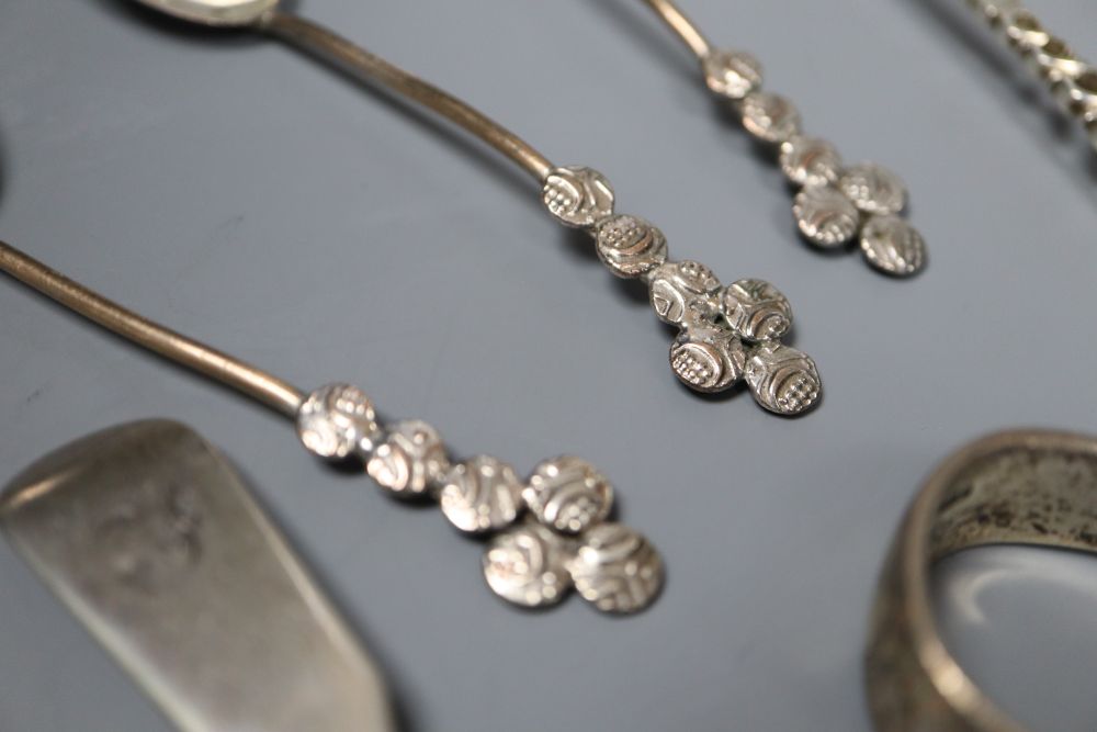 A George V silver vesta case and thirteen pieces of cutlery including eight silver.